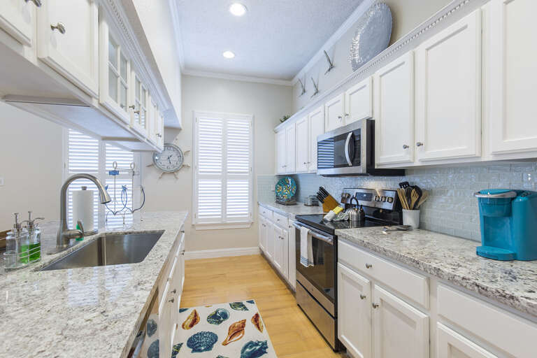 This gorgeous kitchen is fully stocked with all necessary cooking supplies!