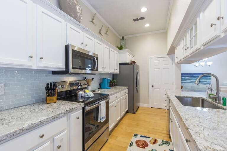 This gorgeous kitchen is fully stocked with all necessary cooking supplies!