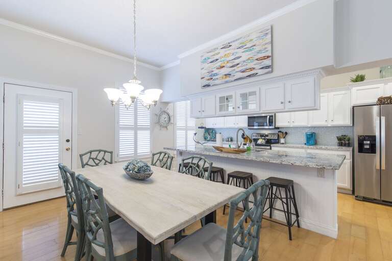 Great dining table for family meals with extra seating for guests at the kitchen counter. Great dining table for family meals with extra seating for guests at the kitchen counter.