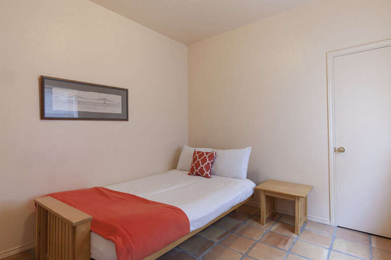 6th bedroom (downstairs) guest bedroom has a Full size Futon and is located off of formal dining area and living room