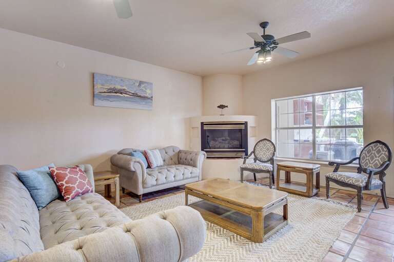 Living room looks out onto the backyard and pool
