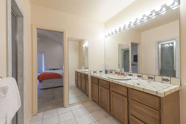 Master bathroom features large vanity and mirror, walk in shower and full bathtub Master bathroom features large vanity and mirror, walk in shower and full bathtub