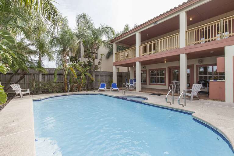 Upstairs balconies overlook the private backyard Upstairs balconies overlook the private backyard