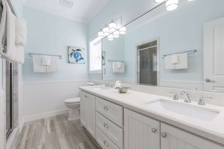 Bathroom with his and her sinks, walk in tile shower!