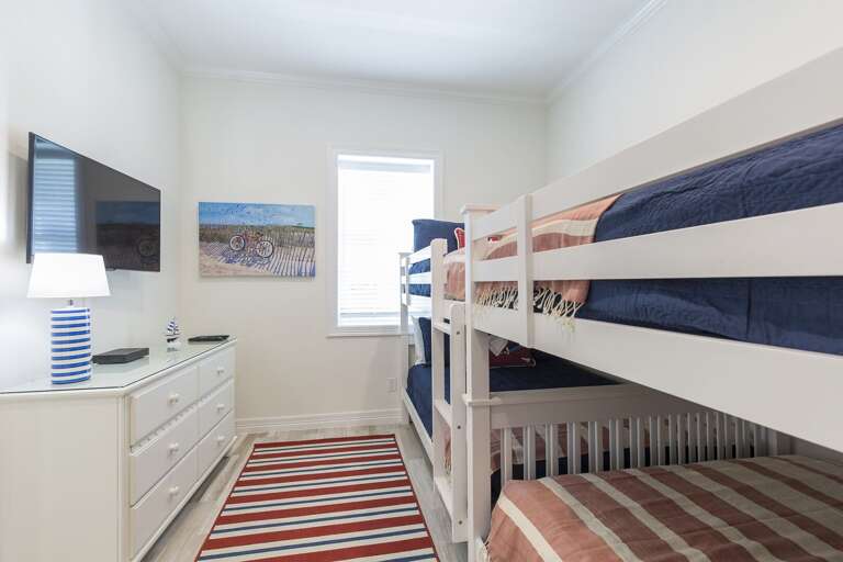 Guest bedroom with full size bunk beds located downstairs!