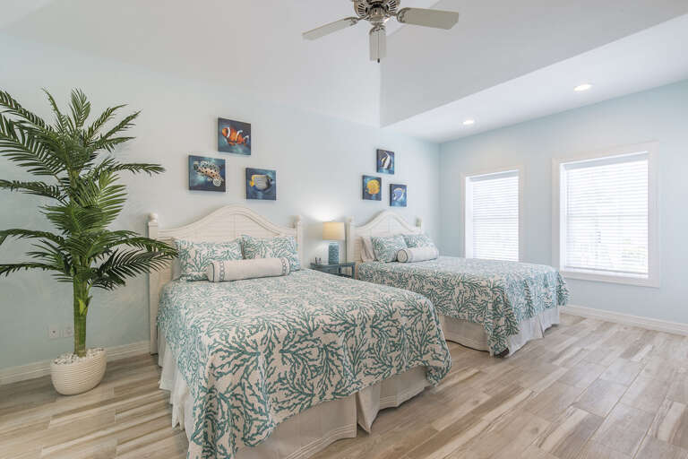 Guest bedroom with two queen beds located upstairs!