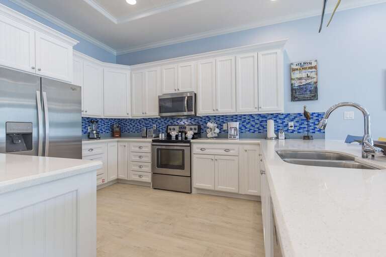 Spacious kitchen fully equipped with kitchen utensils and extra seating!