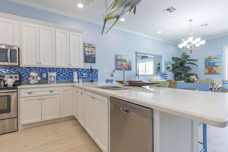 Spacious kitchen fully equipped with kitchen utensils and extra seating!