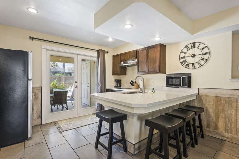 Ground floor suite's kitchen has a full size refrigerator and a 2 burner stovetop. There is no oven.