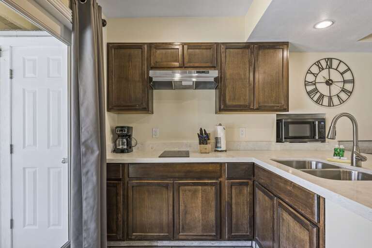 Ground floor suite's kitchen has a full size refrigerator and a 2 burner stovetop. There is no oven.