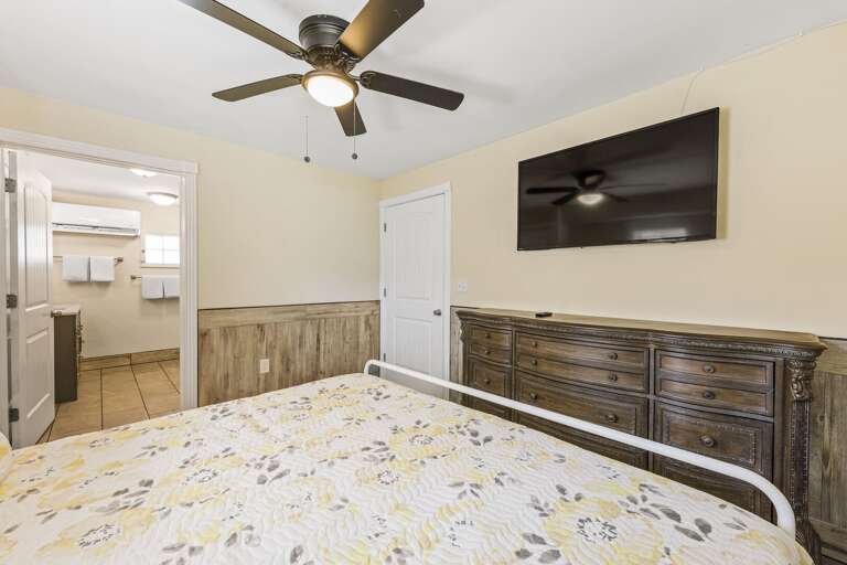 Ground floor suite's master bedroom features a King size bed and flat screen TV.