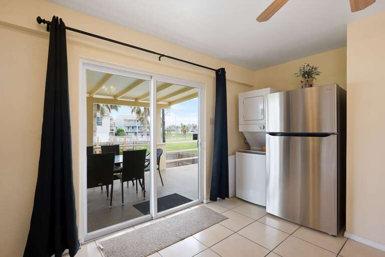 Large kitchen with stainless steel appliances. There is also a washer & dryer for guest use.