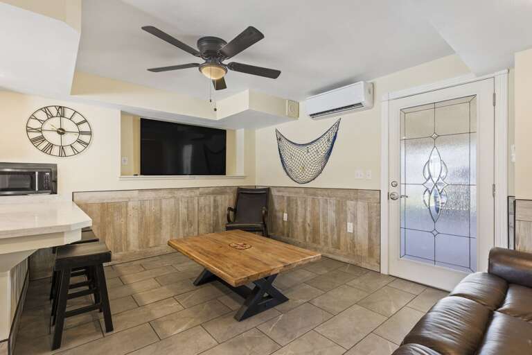 Newly renovated ground floor "in-law" suite! Living room features a large flat screen TV.