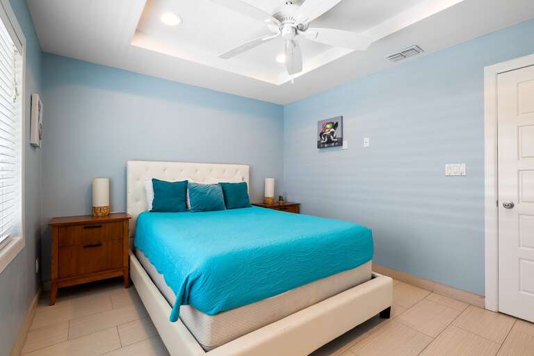 2nd bedroom with a King bed and flat screen TV. Located on the 2nd floor.