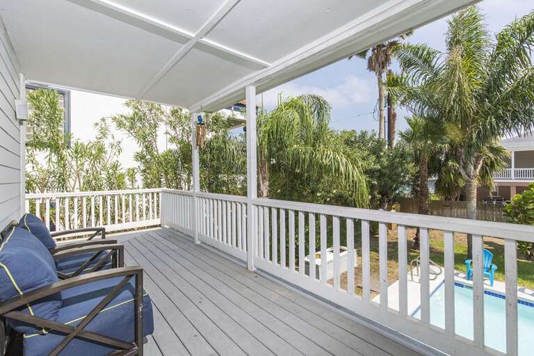 2nd floor balcony overlooking tropical pool area.