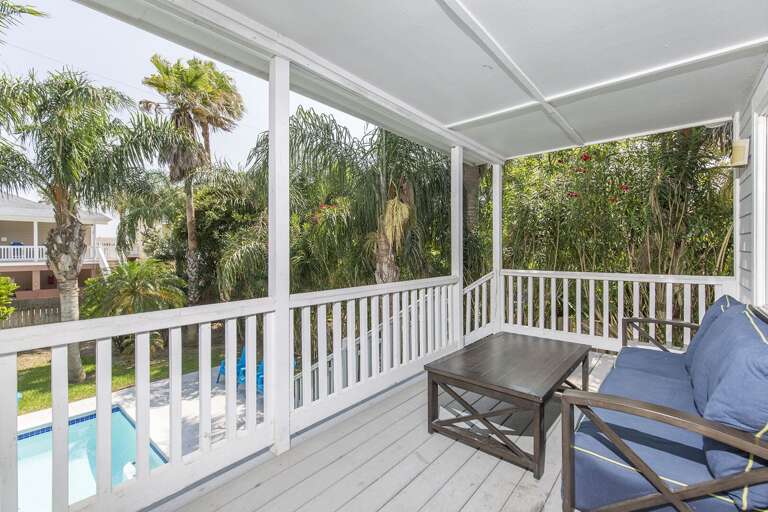 2nd floor balcony overlooking tropical pool area.