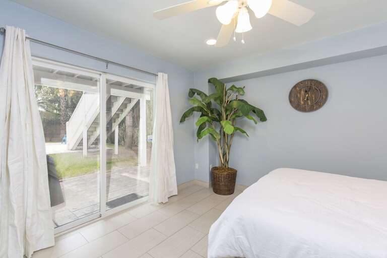 4th bedroom with Queen bed, flat scree TV and back patio/pool access. Located on the ground floor.