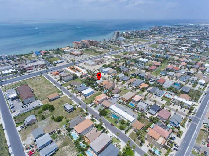 Aerial view of the property (the red pin is our home). Enjoy being walking distance to the beach!