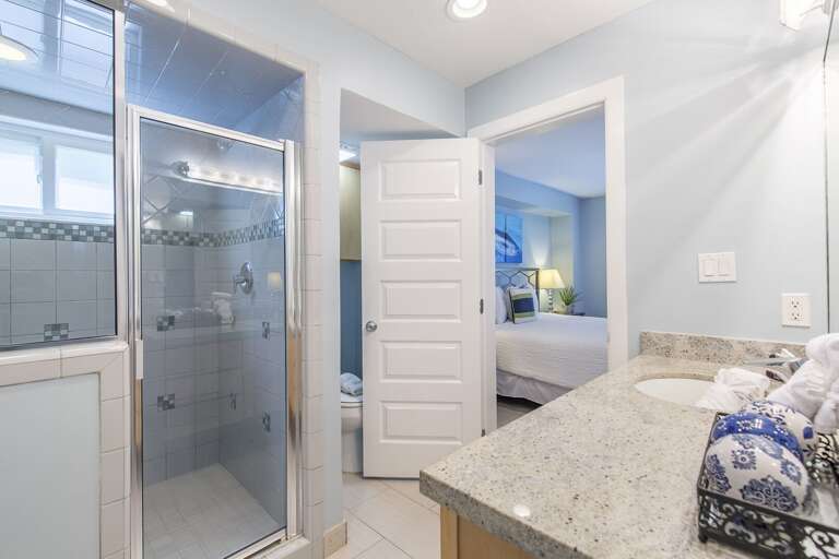 Downstairs guest bathroom with walk-in tiled shower.