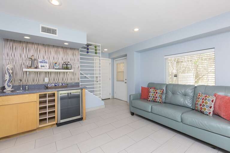 Downstairs living area and wet bar. This room is located just off the pool area and is attached to the 3rd and 4th bedrooms.