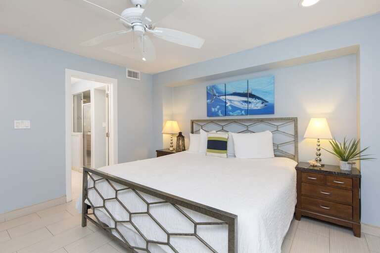 Spacious guest bedroom with a King bed and flat screen TV. Located on the ground floor.