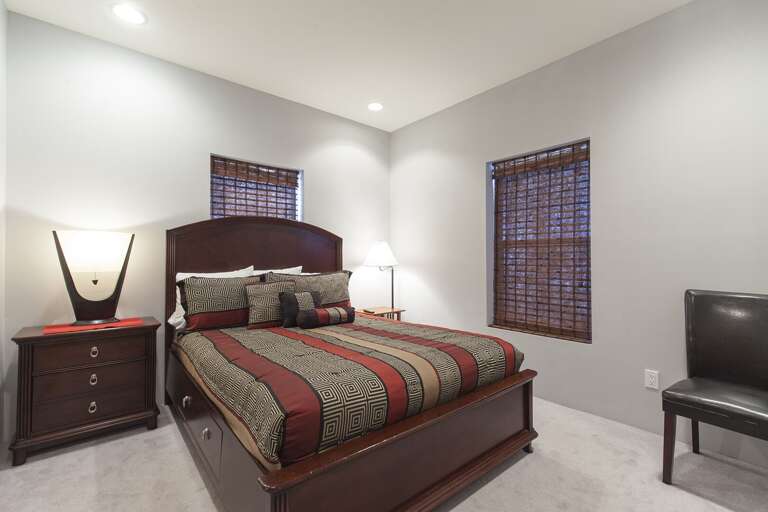 Bedroom 3 features a queen bed and flat screen TV.