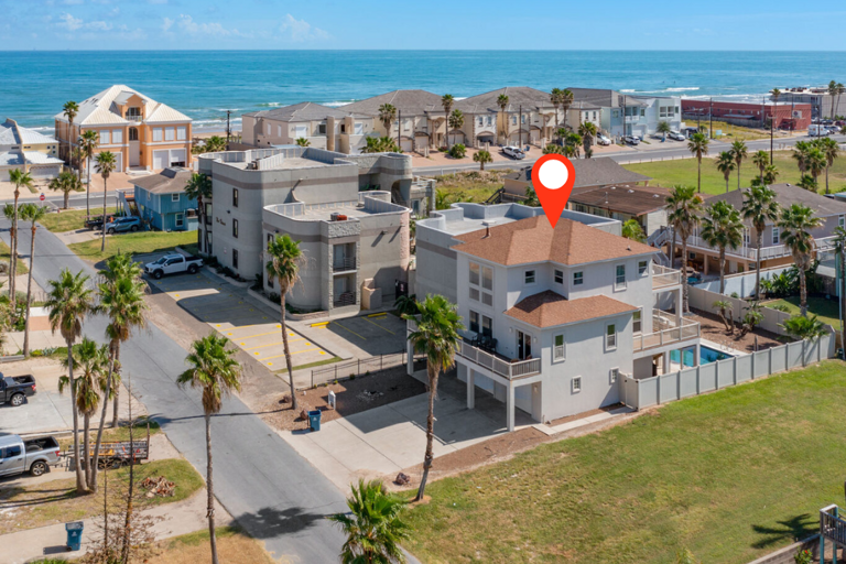 Spacious beach house just steps from the sand with a private pool, hot tub, and room for the whole group.