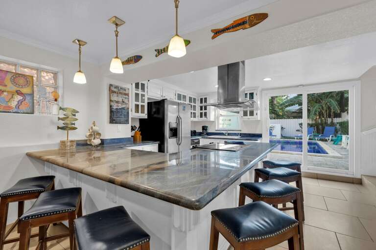 Kitchen Area with ample seating around the counter Kitchen Area with ample seating around the counter