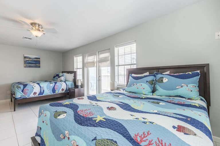 2nd floor bedroom #1 has private access to south side balcony (Two Queen Beds)