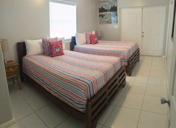 2nd floor bedroom #2 has private balcony (Two Full Beds)