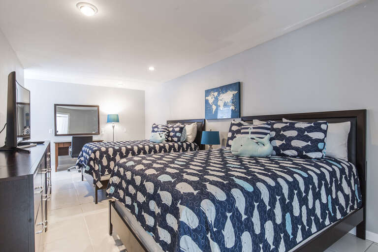 2nd floor bedroom #3 with large closet and desk/chair (Two Queen Beds and a single twin bed not shown in picture, 4K Ultra Curved HDTV)