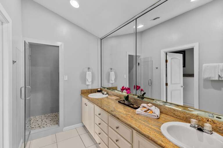 3rd floor bathroom #1 has a newly remodeled walk-in shower, larger double vanity with lots of storage and counter space and oversized vanity mirror