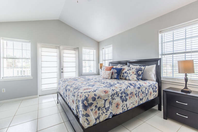 3rd floor bedroom #2 has private access to north side balcony (One King Bed)