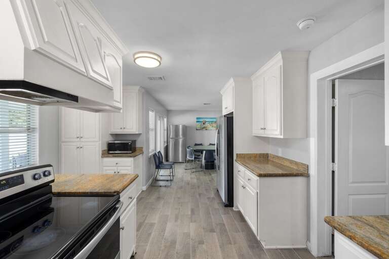Large kitchen with stainless steel appliances