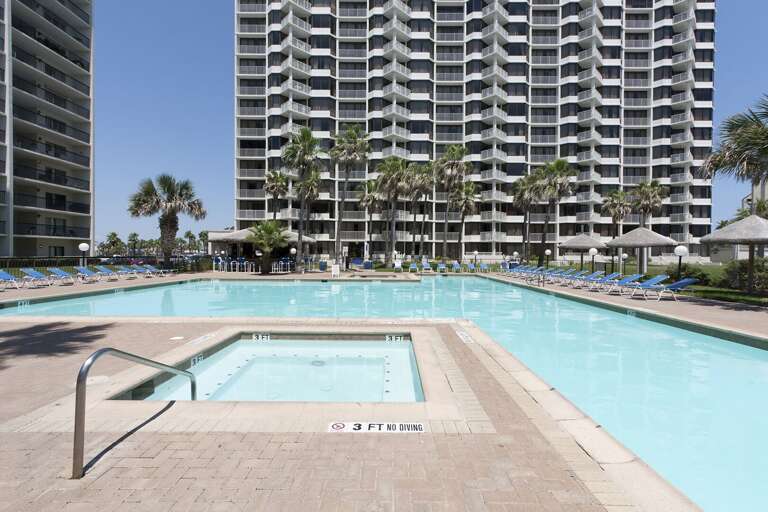 Stretch out poolside and enjoy the warm South Padre Island sunshine just steps from your condo.