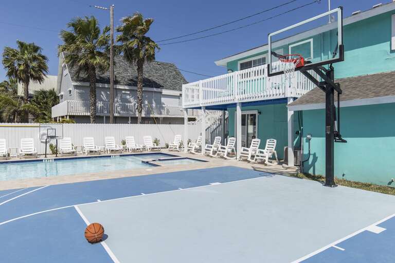 Multiple purpose basketball court with adjustable basketball hoop.