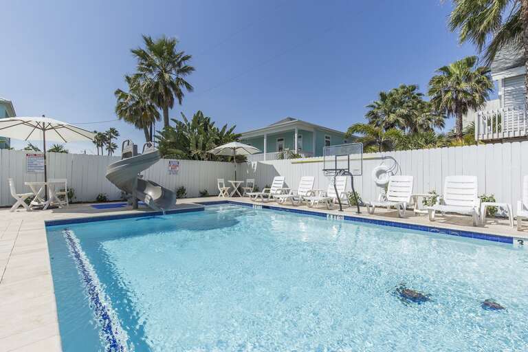 Twister water slide/oversize hot tub/tanning shelf/pool side.