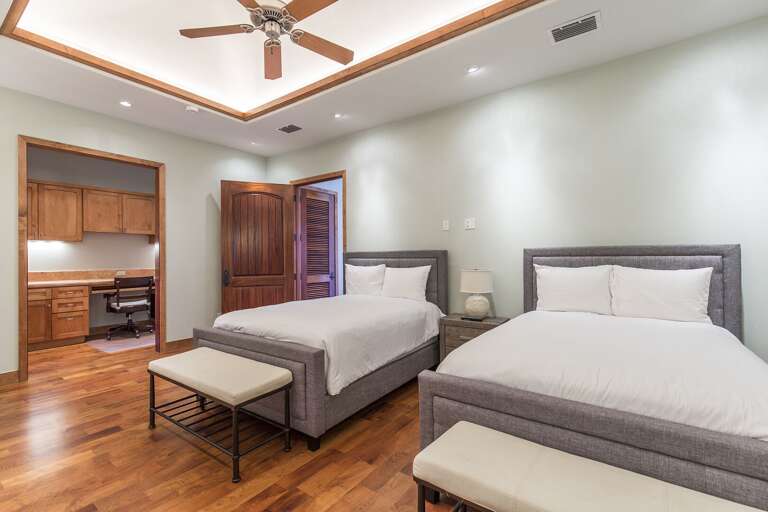 3rd floor guest bedroom with 2 full beds.