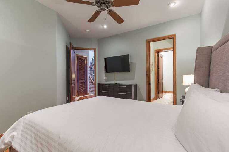 Guest room with queen bed and flat screen tv