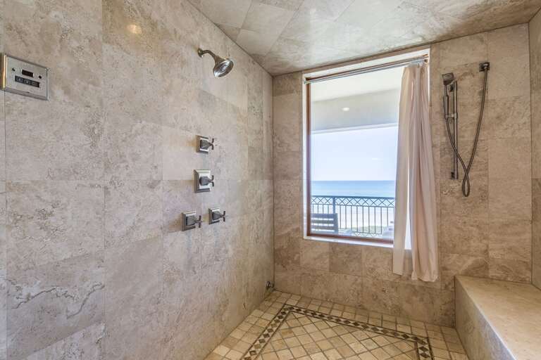 Master bathroom with an ocean view