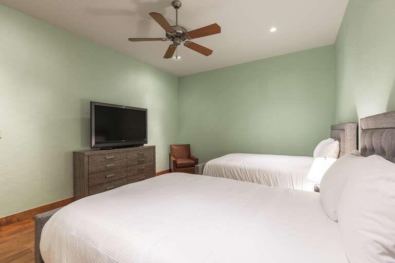 Guest bedroom with two full beds