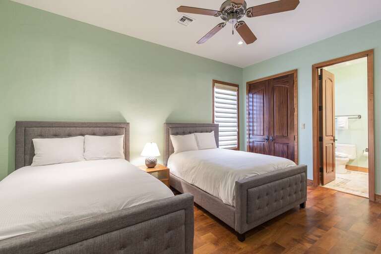Guest bedroom with two full beds