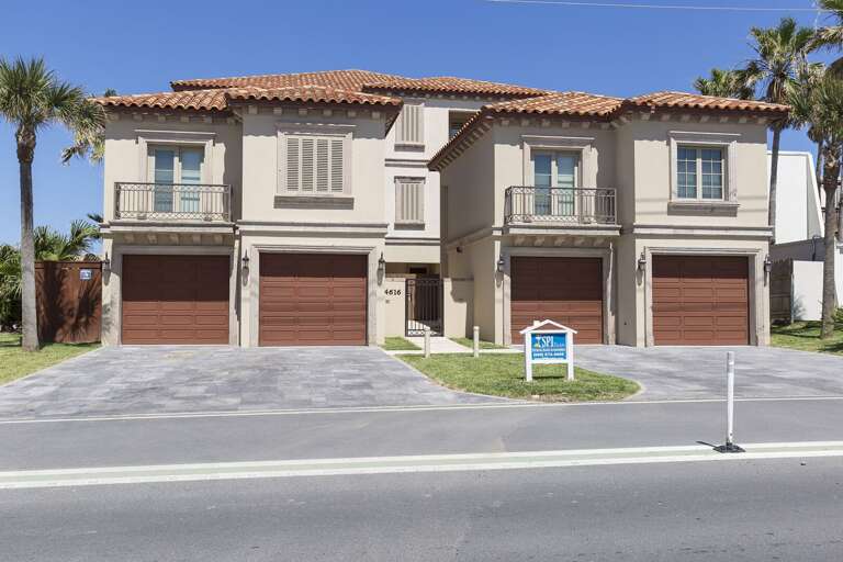 Street view of our beach house! It is the townhome on the right side (south). Garage is available, garage suite/apt is NOT included in this rental. See description.