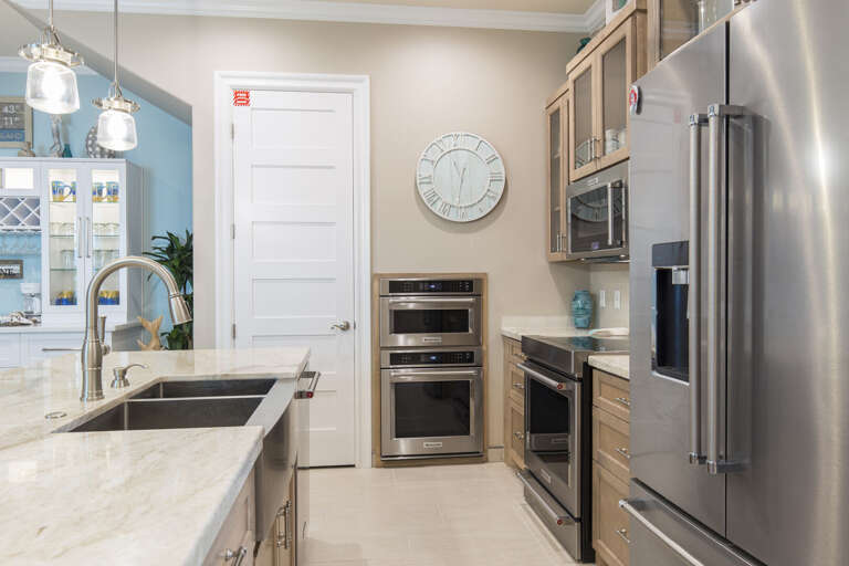 Fully stocked kitchen with stainless steel appliances
