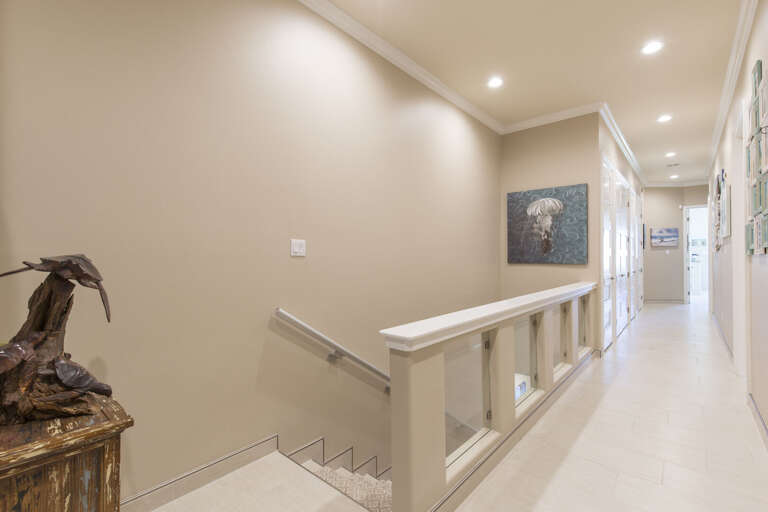 Stair way downstairs and hallway to bedrooms