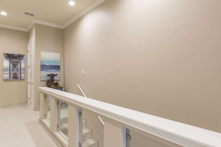 Stair way downstairs and hallway to bedrooms