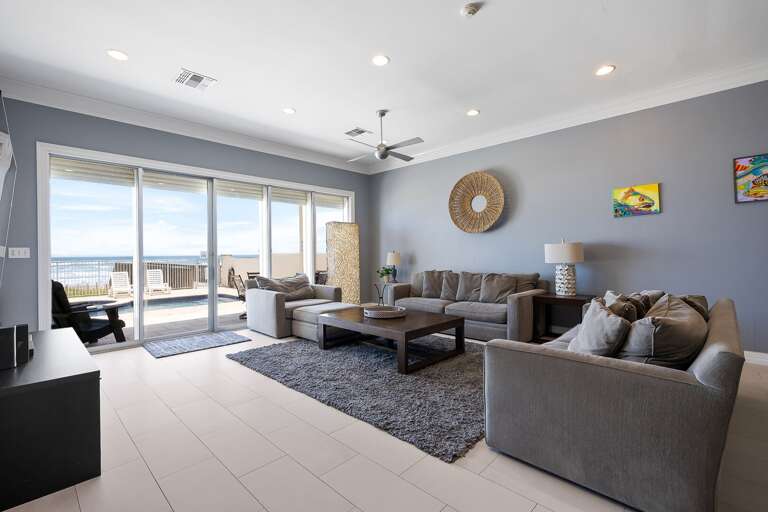 Living Area with ample seating surrounding a flat screen TV perfect for movie nights!