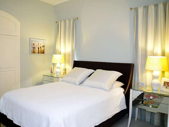 Ground floor bedroom with a queen bed.