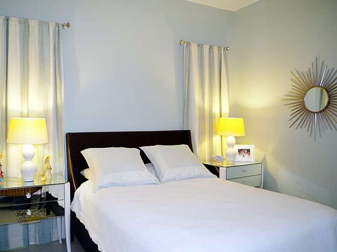 Ground floor bedroom with a queen bed.