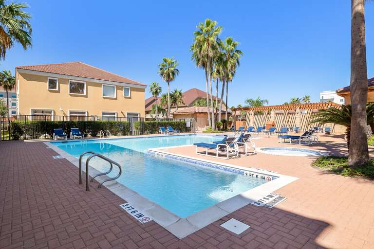 Large community pool with lounge chairs that get plenty of sun during the day!